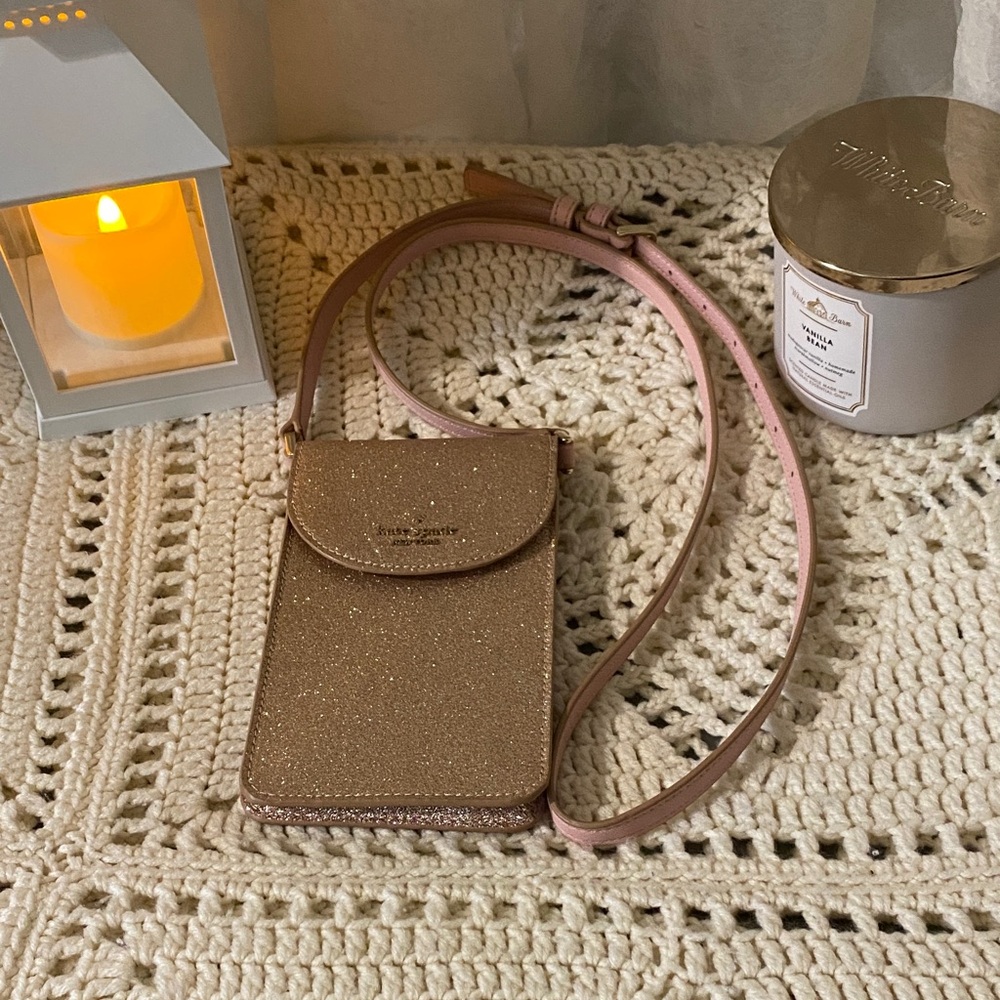 Kate Spade New York Stylish metallic Rose Gold Crossbody purse.